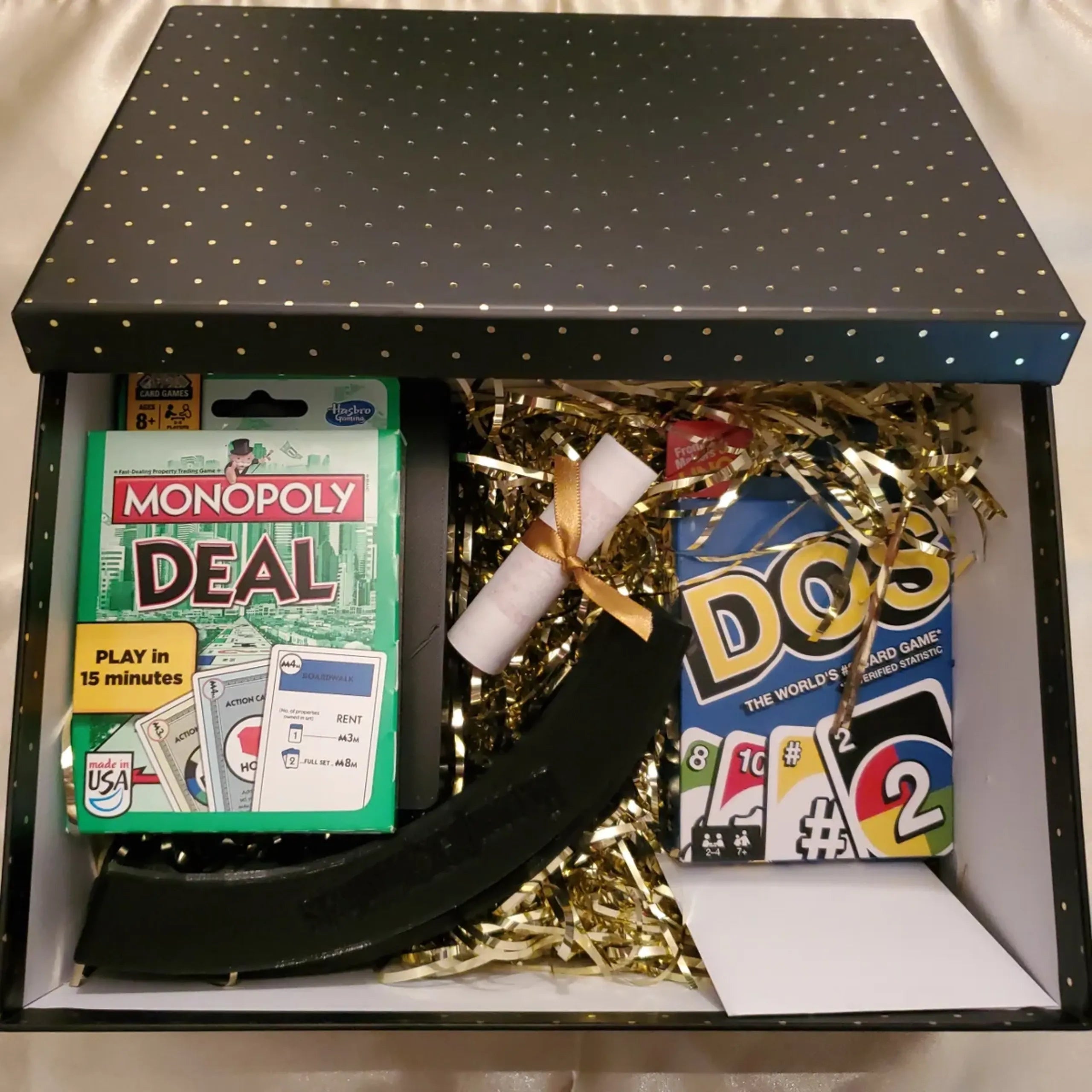 Monopoly Deal card game and essentials in a Game Night Gift Box